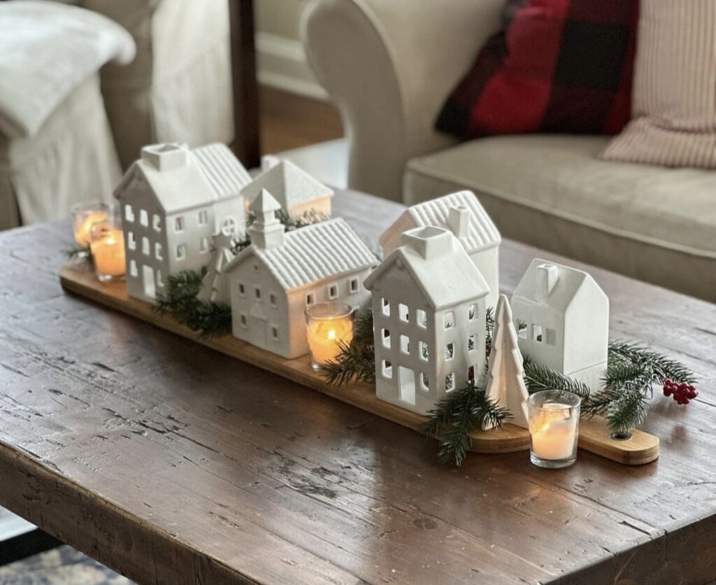 A Christmas centerpiece with white Christmas houses.