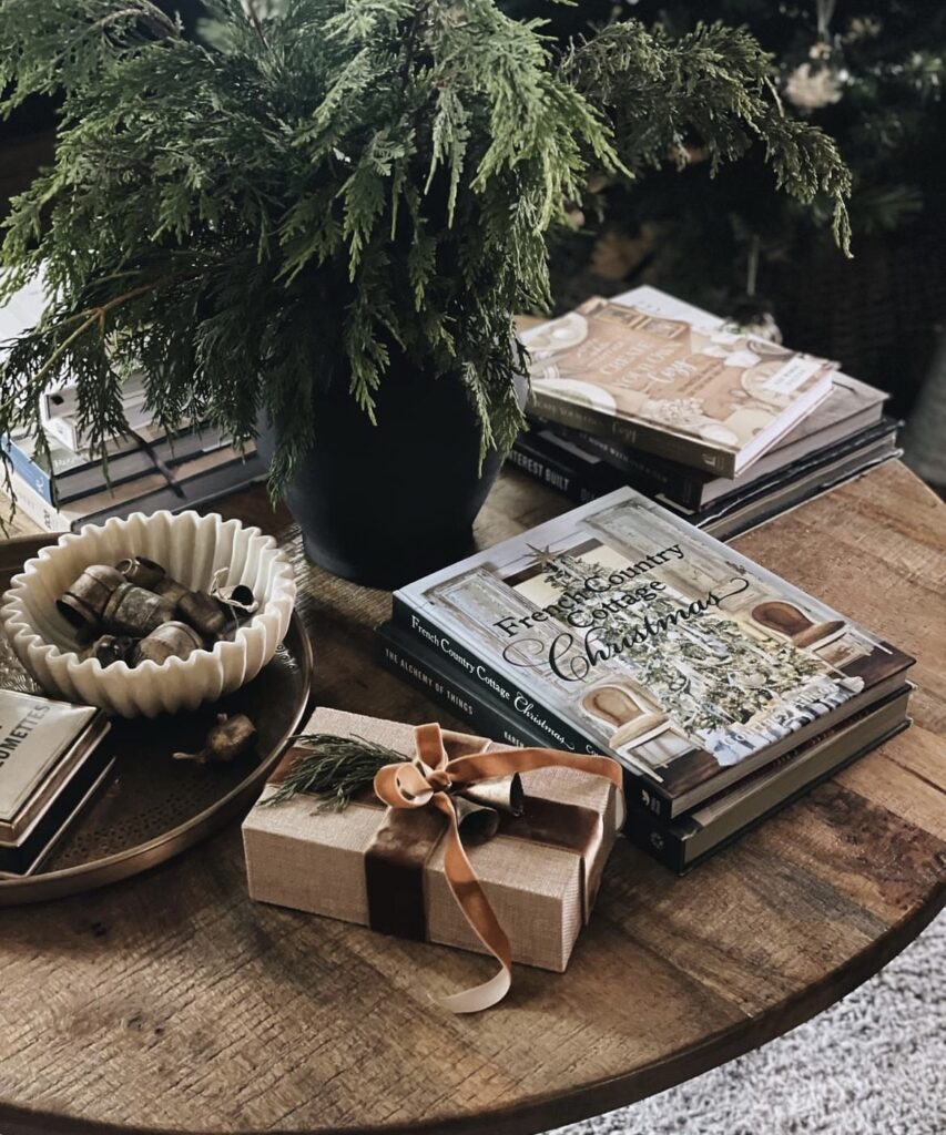 Pine branches, jingle bells and brown velvet ribbon.