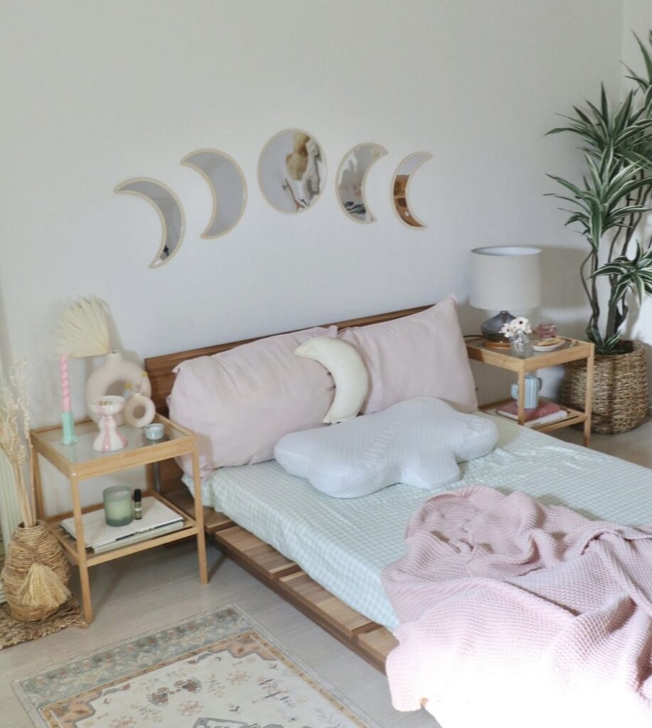 A bedroom with celestial decorative items.