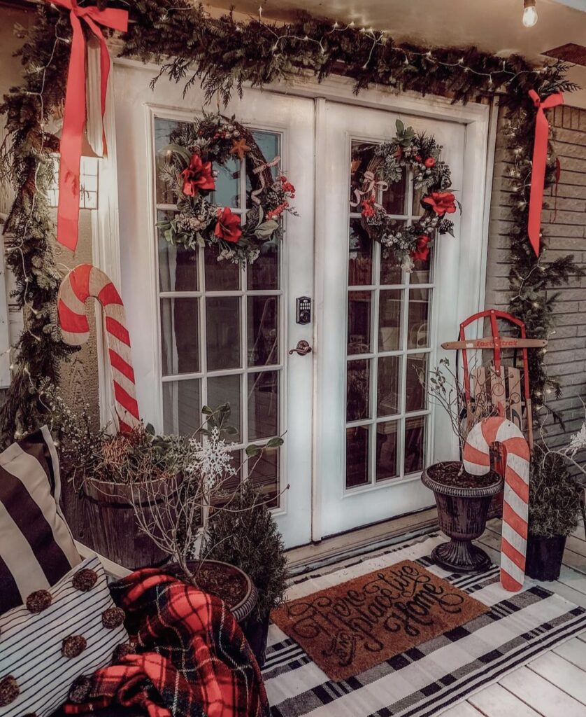 A Christmas porch with sugar cane wooden signs.