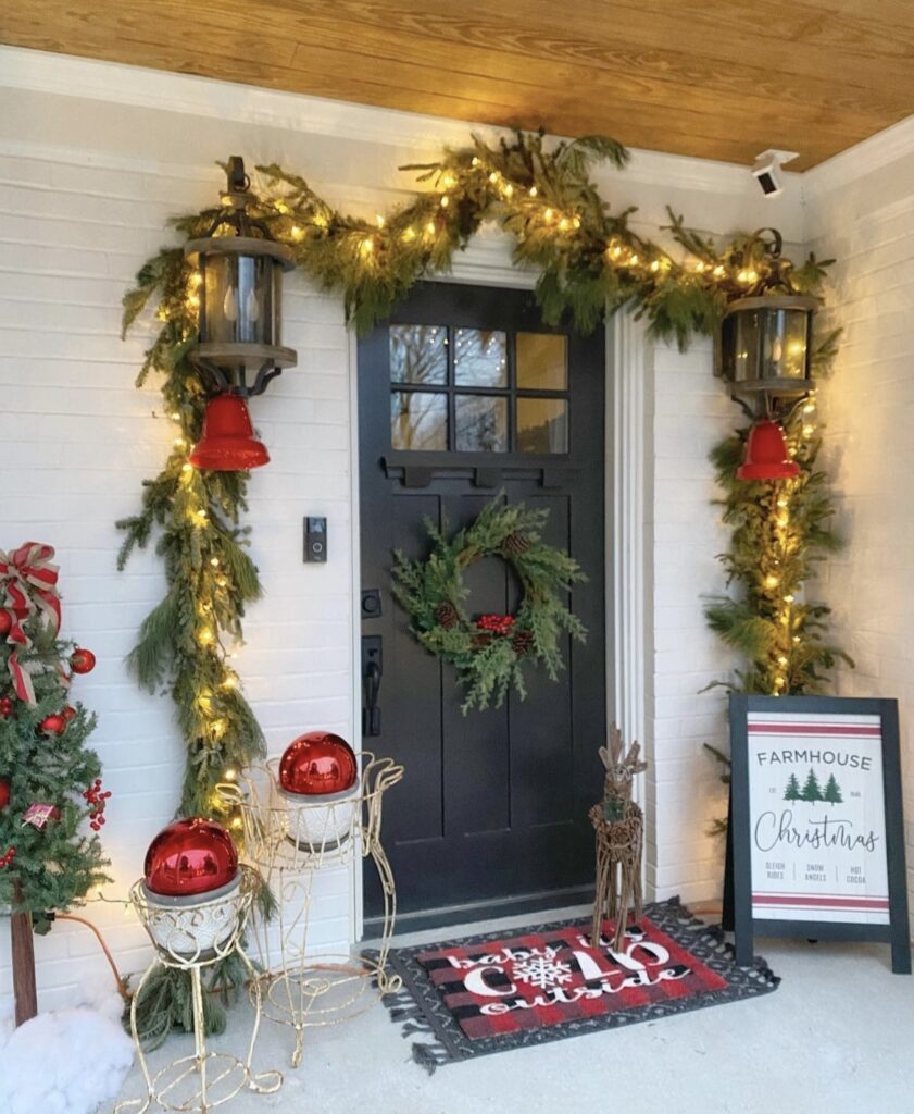 A pine branch garland with string lights.