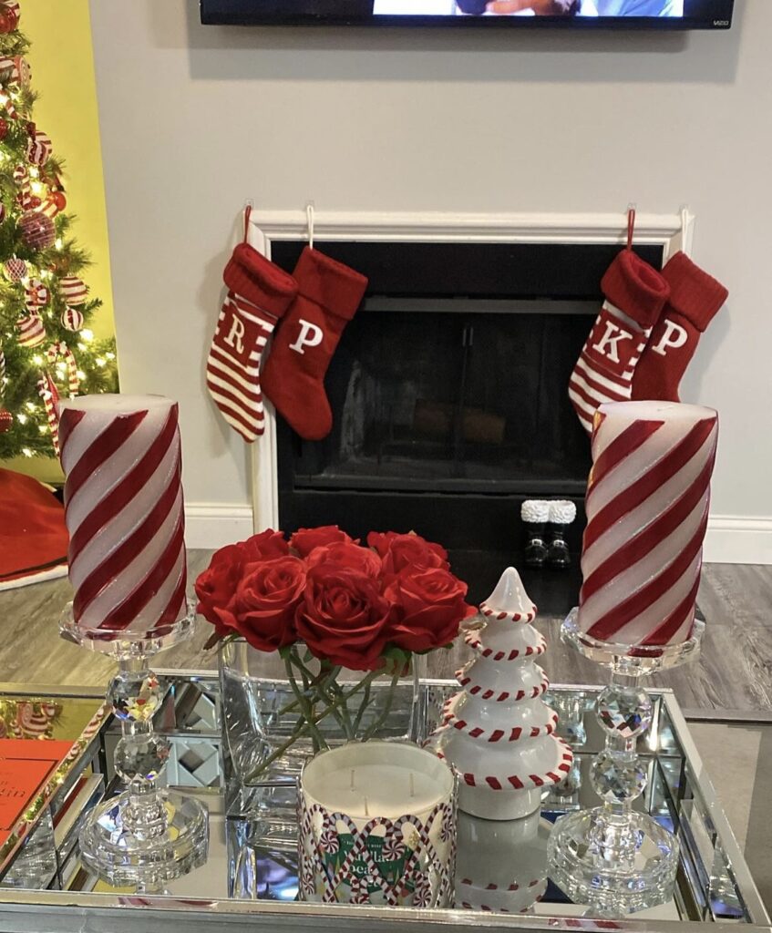 Glass candle holders with white and red candles.