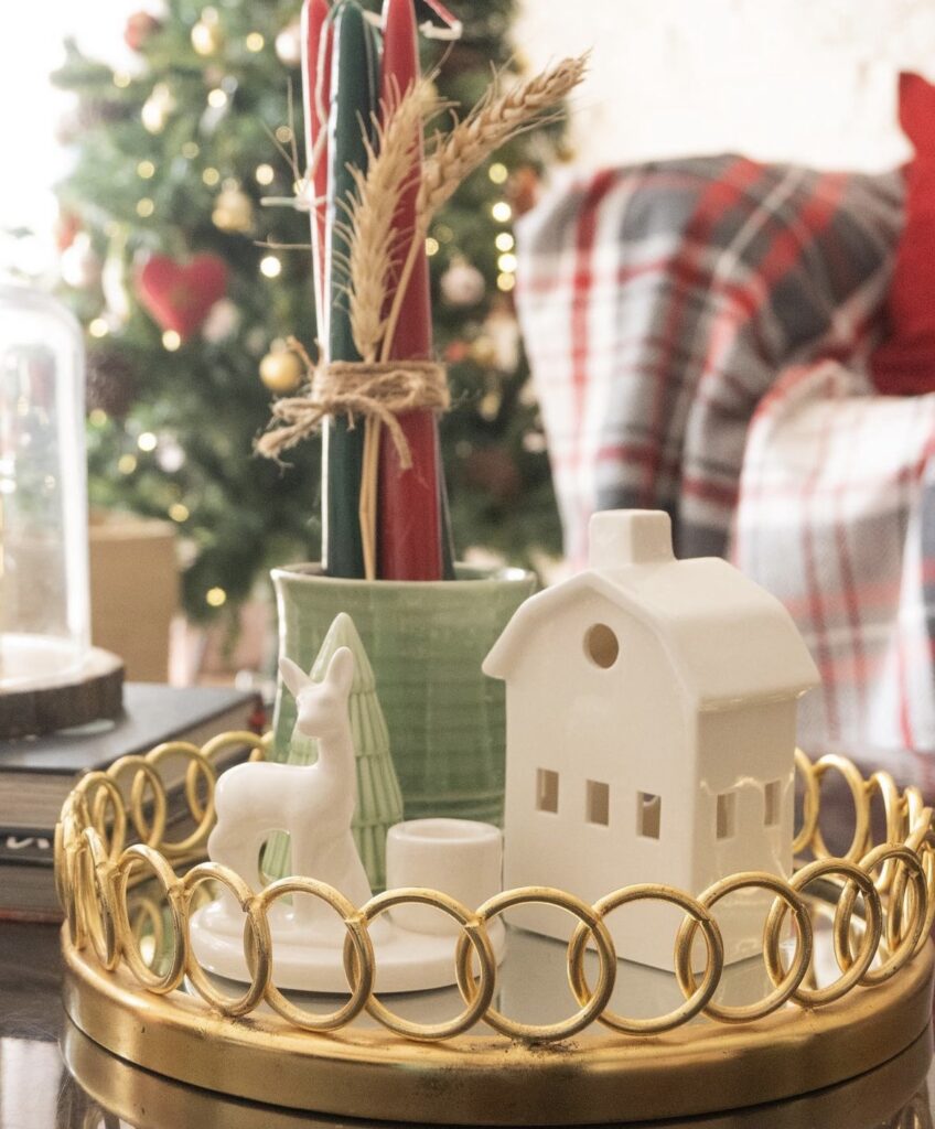 Christmas white houses with red and green taper candles.