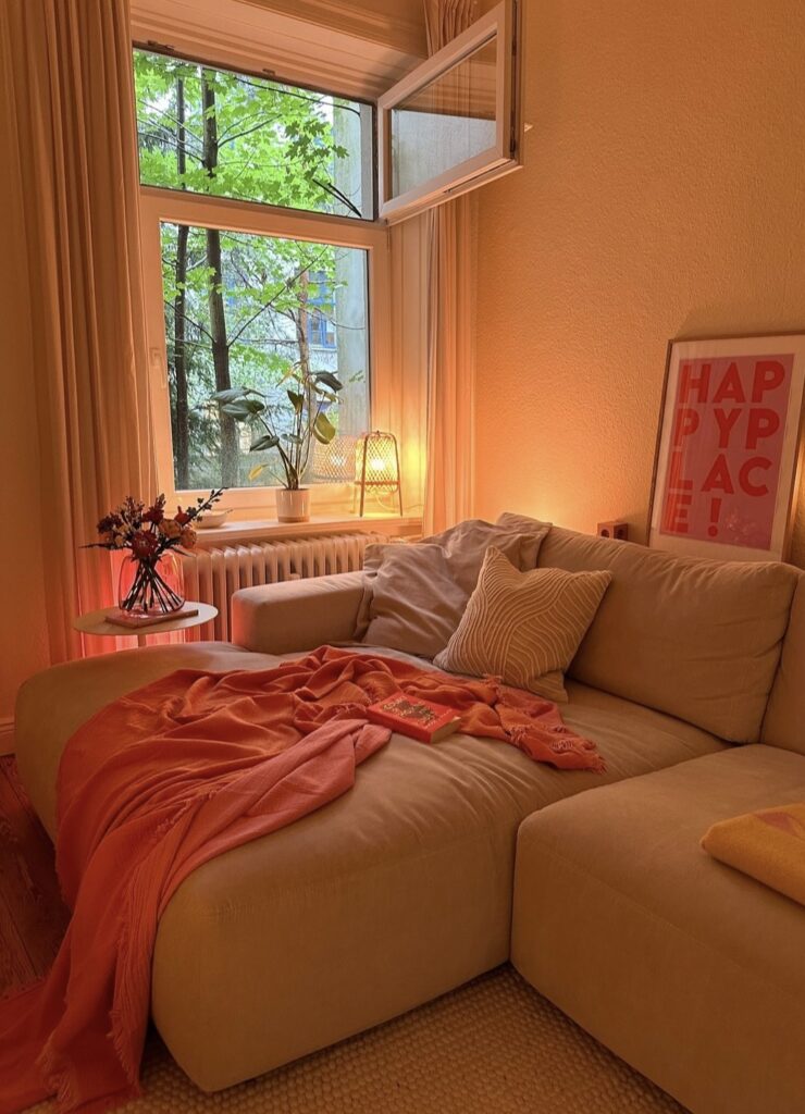 A cozy living room with warm LEDs and candles.