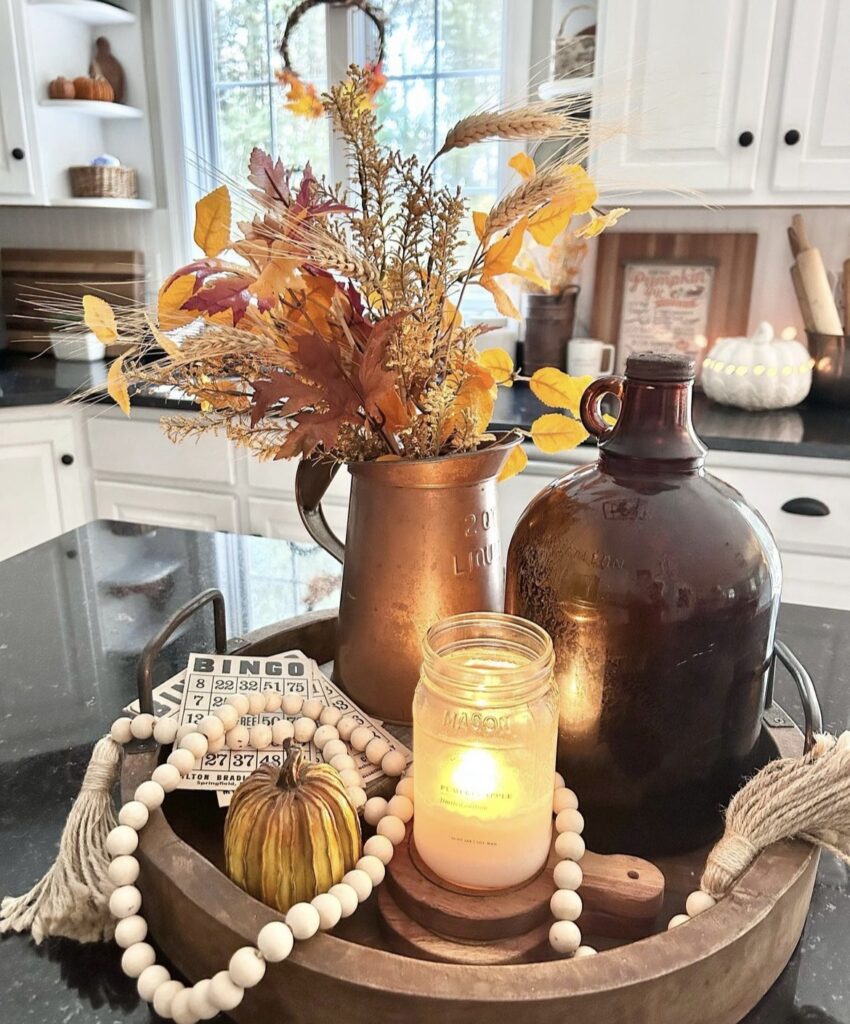 An antique pitcher with fall stems.