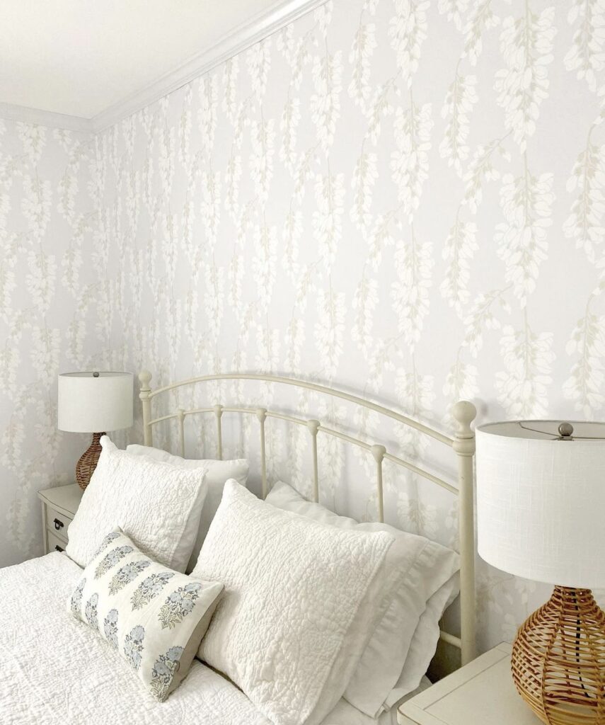 Woven lamps and wallpaper in a bedroom.