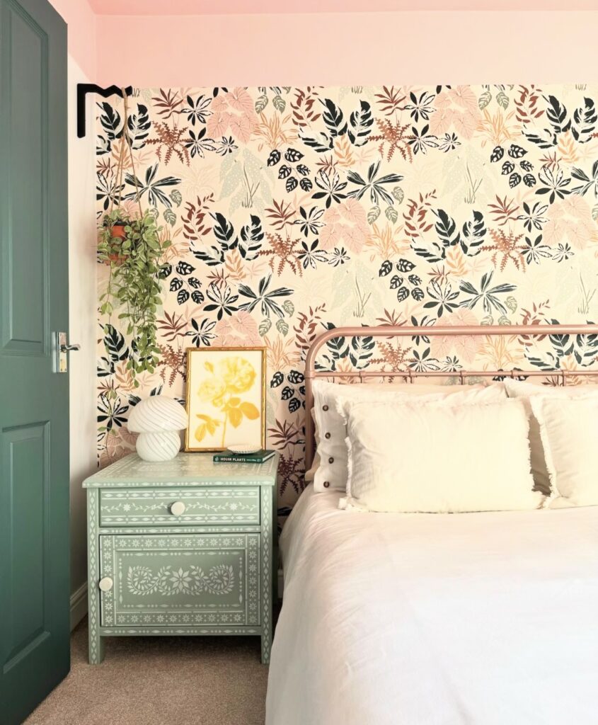 A bedroom with many patterns.