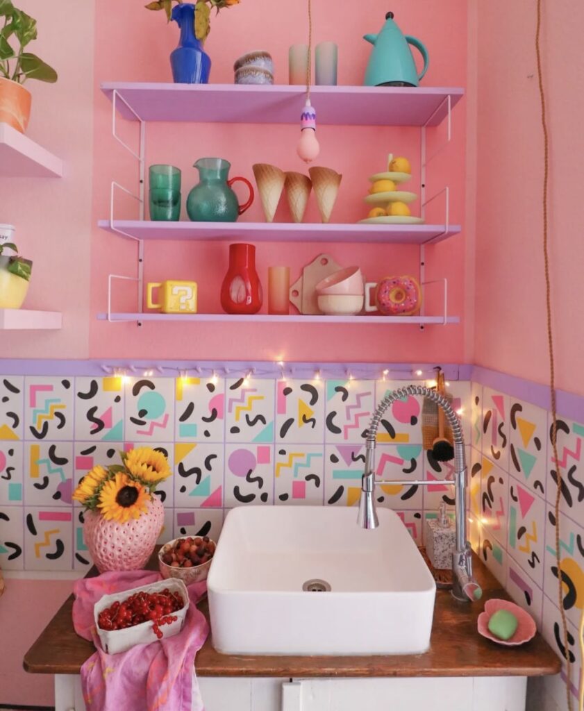 A kitchen with colorful and funky backsplash tiles.