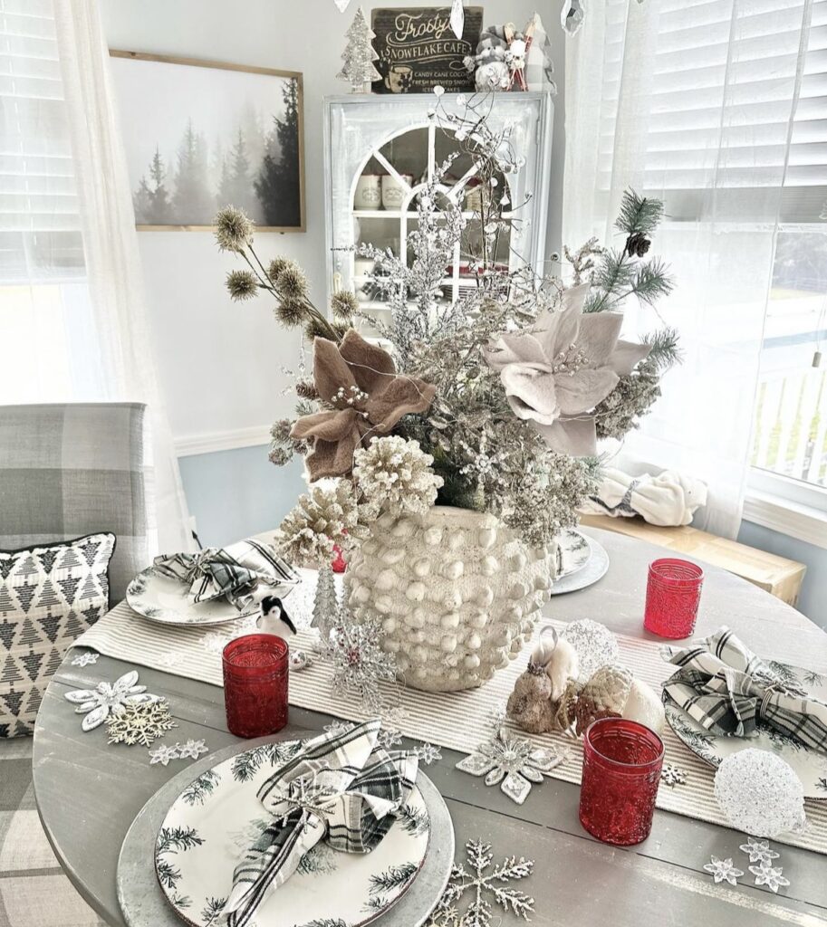 A white textured vase with winter branches.