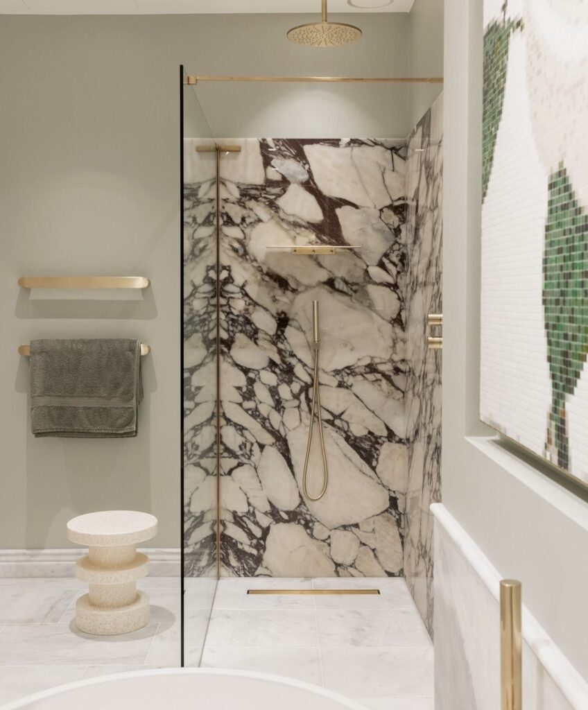 A marble shower in a luxurious bathroom.