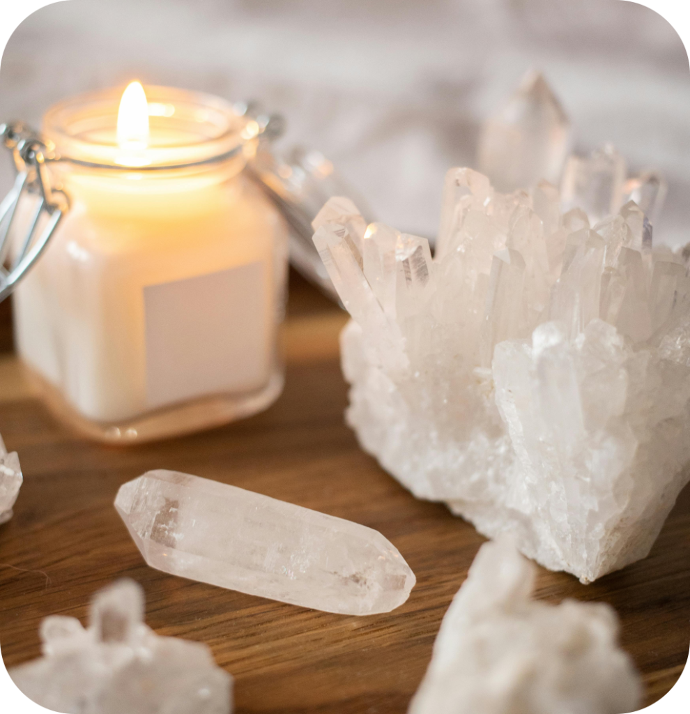 A candle with clear quartz.