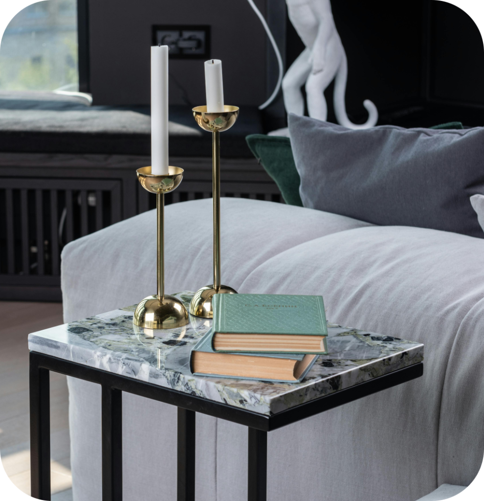 A black coffee table with a marble countertop.