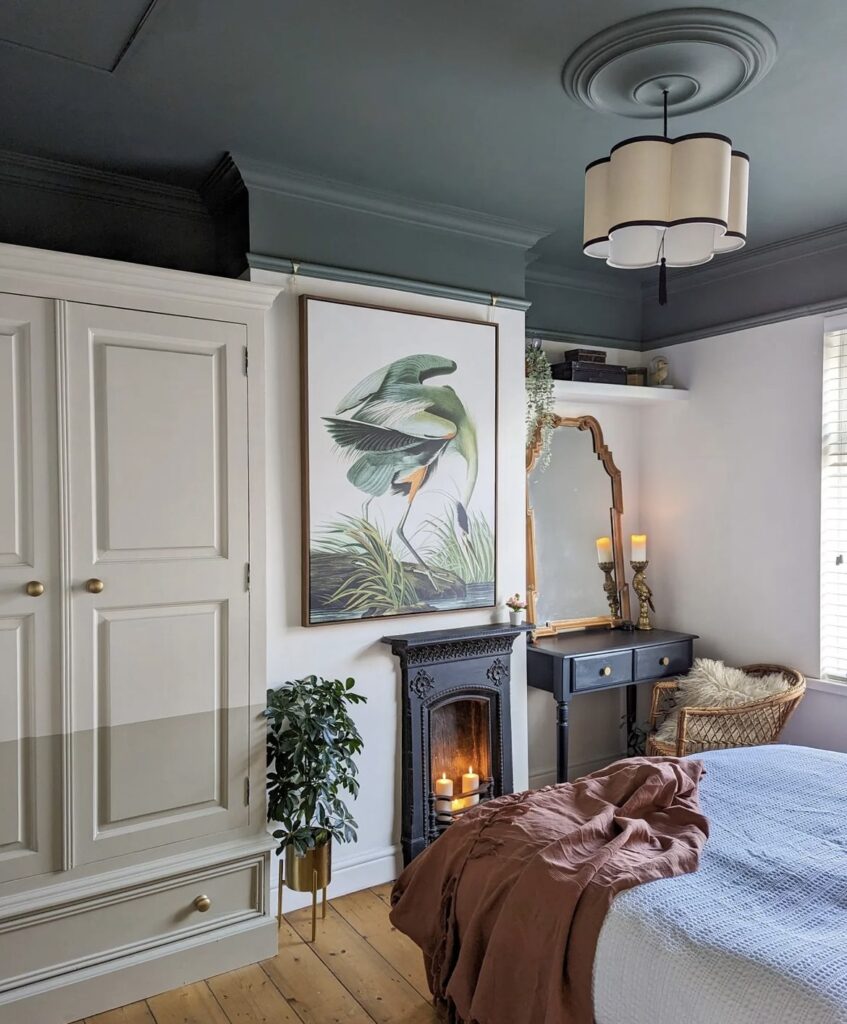 A bedroom with a dark ceiling.