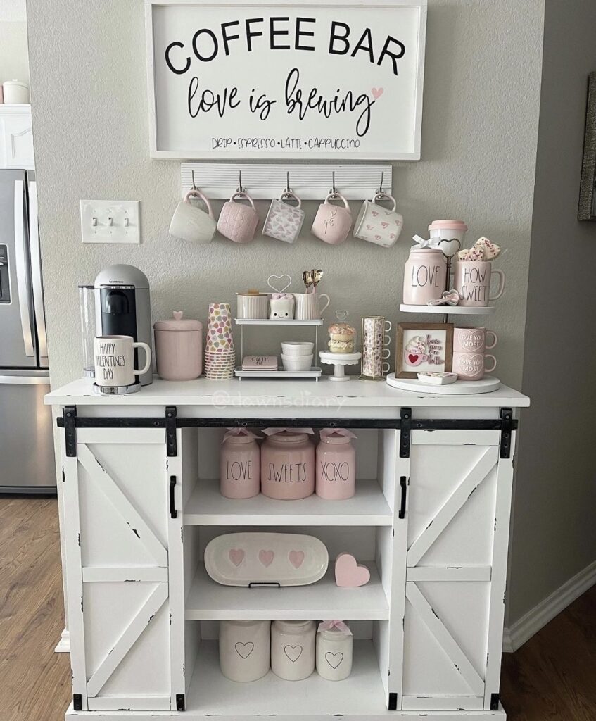 Pink Valentine canisters and mugs on a coffee bar.