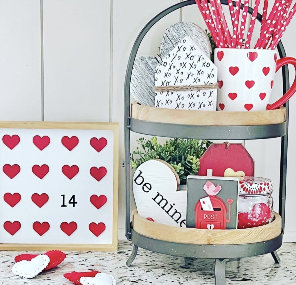 A Valentine tray with cutouts, quotes, and mugs.