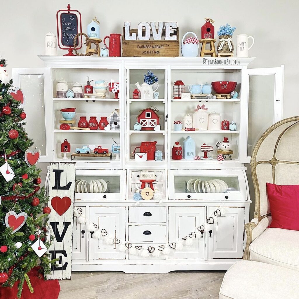 A shelf with love signs, Valentine canisters and mugs.