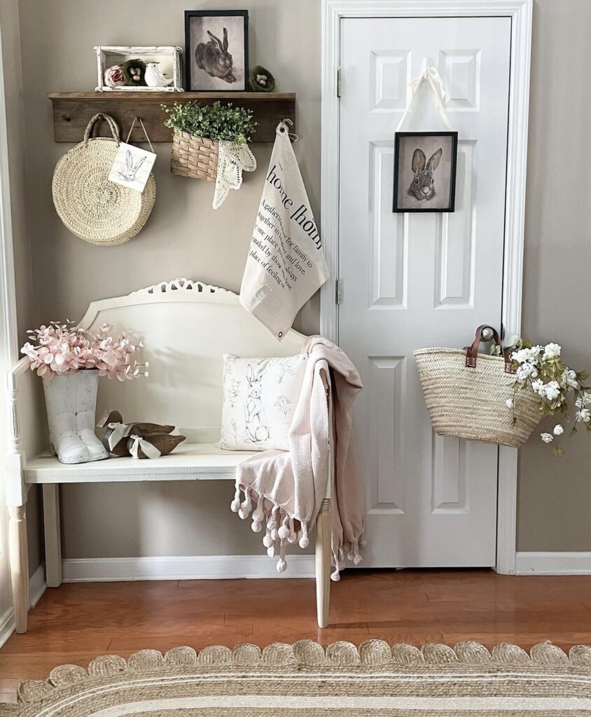 An entryway with rabbit framed paintings.