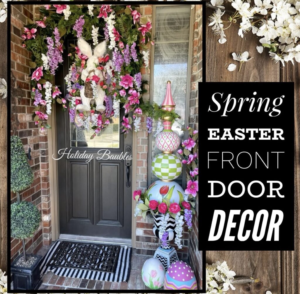 A garland with pink and purple flowers on a black front door.