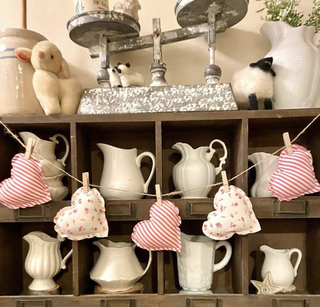 A heart garland on a shelf.