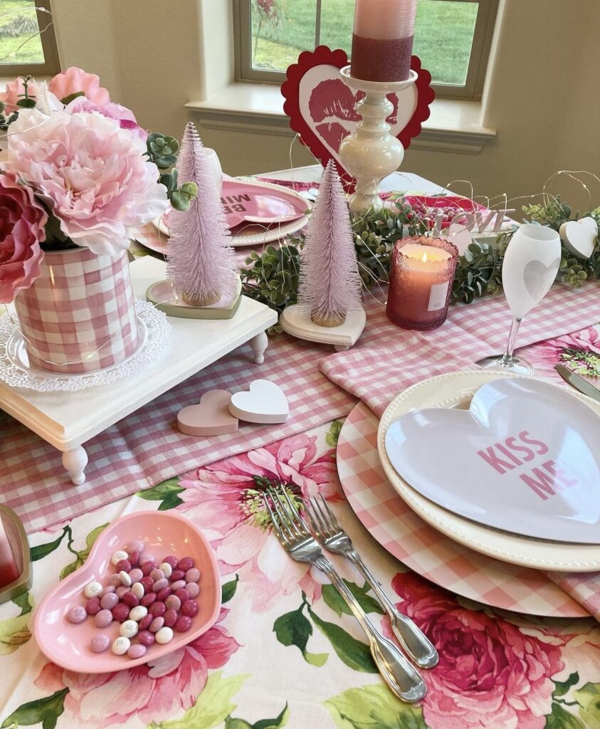 A pink gingham table runner and napkins for a Valentine's Day table.