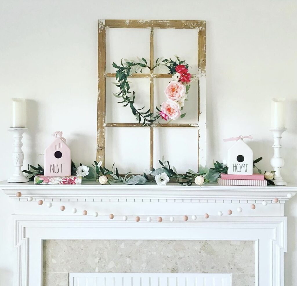 A mantel with a Valentine wreath.