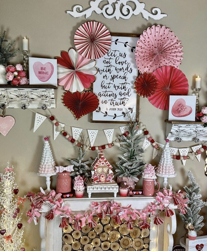 A mantel with winter figurines, Valentine paper fans and garlands.