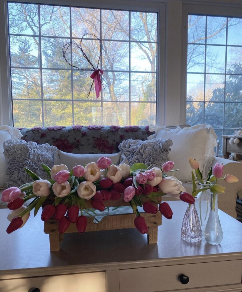 Pink and red tulips in a living room.