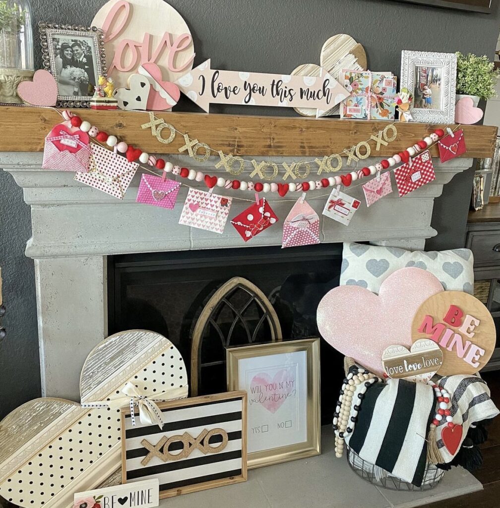 A mantel with Valentine signs and garlands.