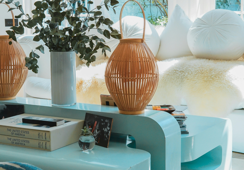 A coastal living room with blue and woven furniture.