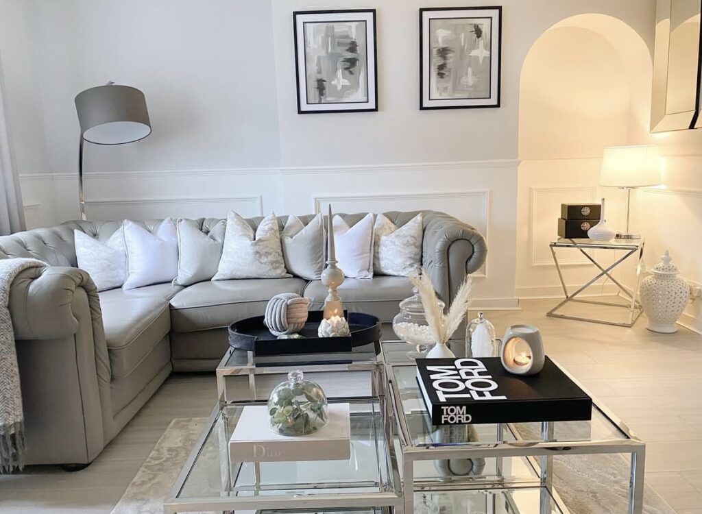 A modern living room with a metallic coffee table.