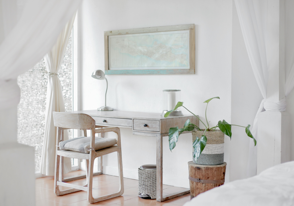 A white desk and curtains.