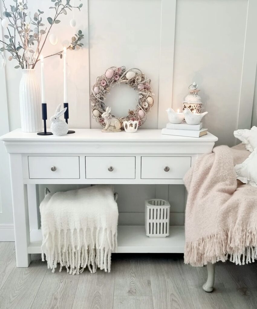 An Easter wreath on a console table.