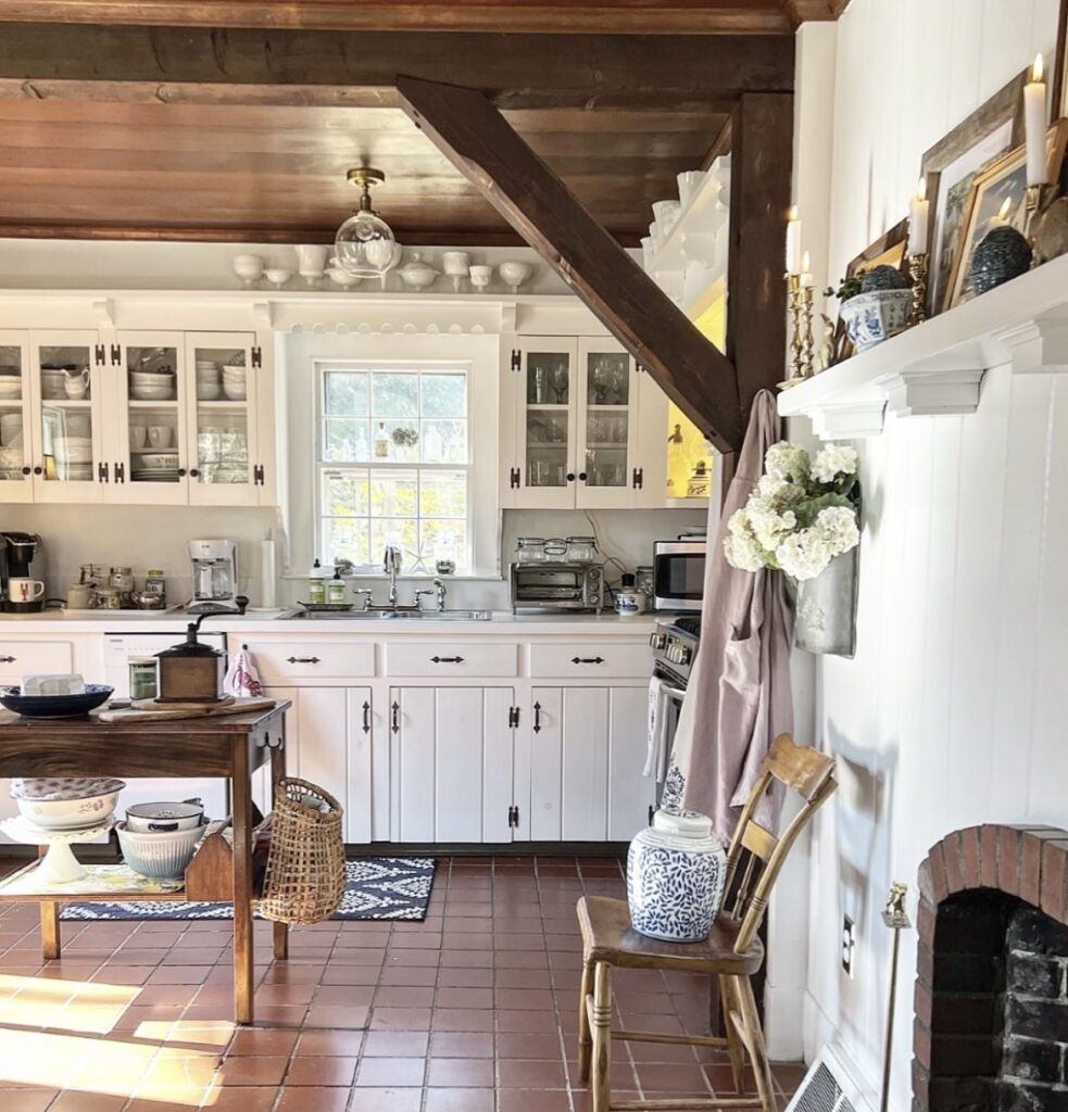 A traditional kitchen with a wooden cabinet.