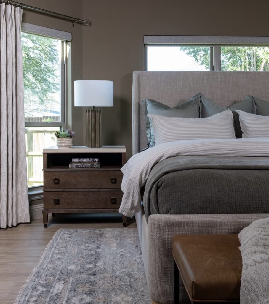 A modern bedroom with an earthy color palette.