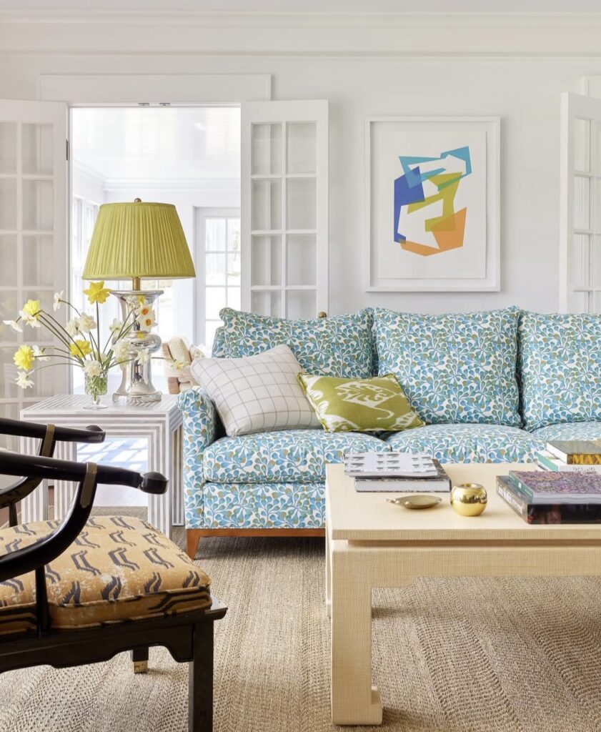 A modern living room with colorful patterns.