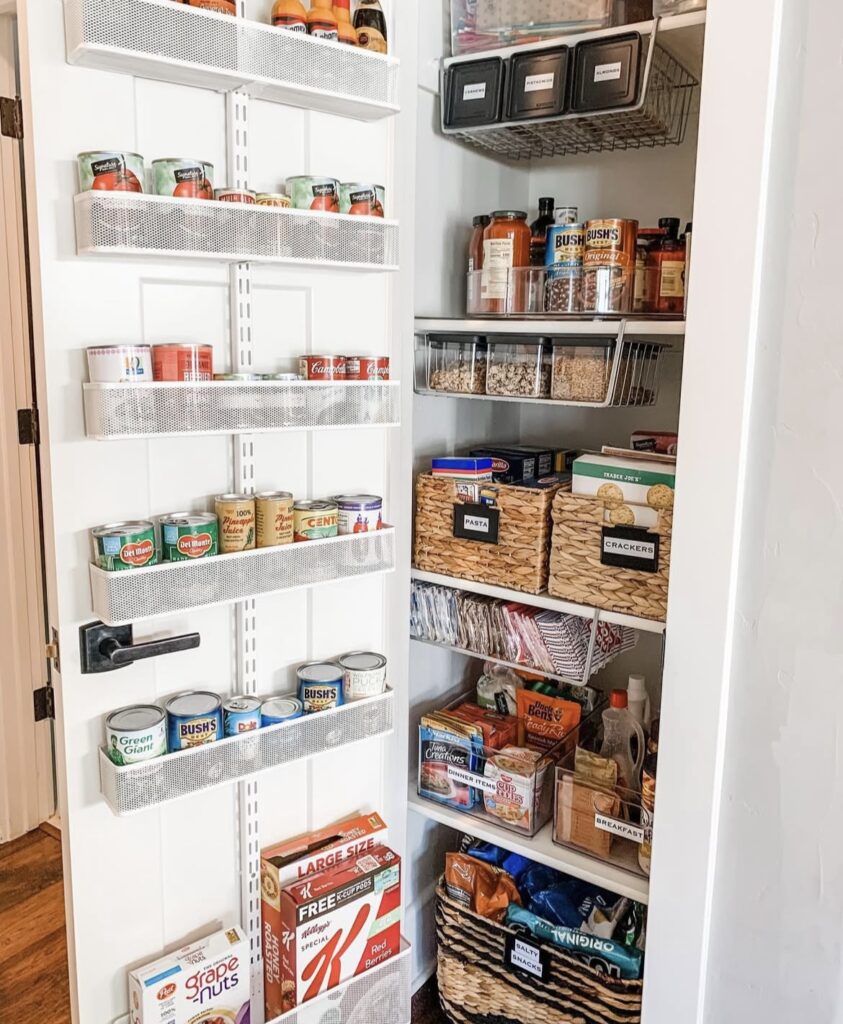 A small pantry with an over the door organizer.