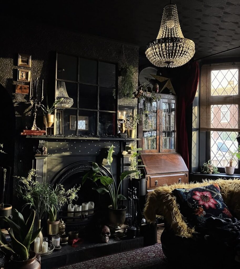 A fireplace with plants and vintage furniture in a black living room.