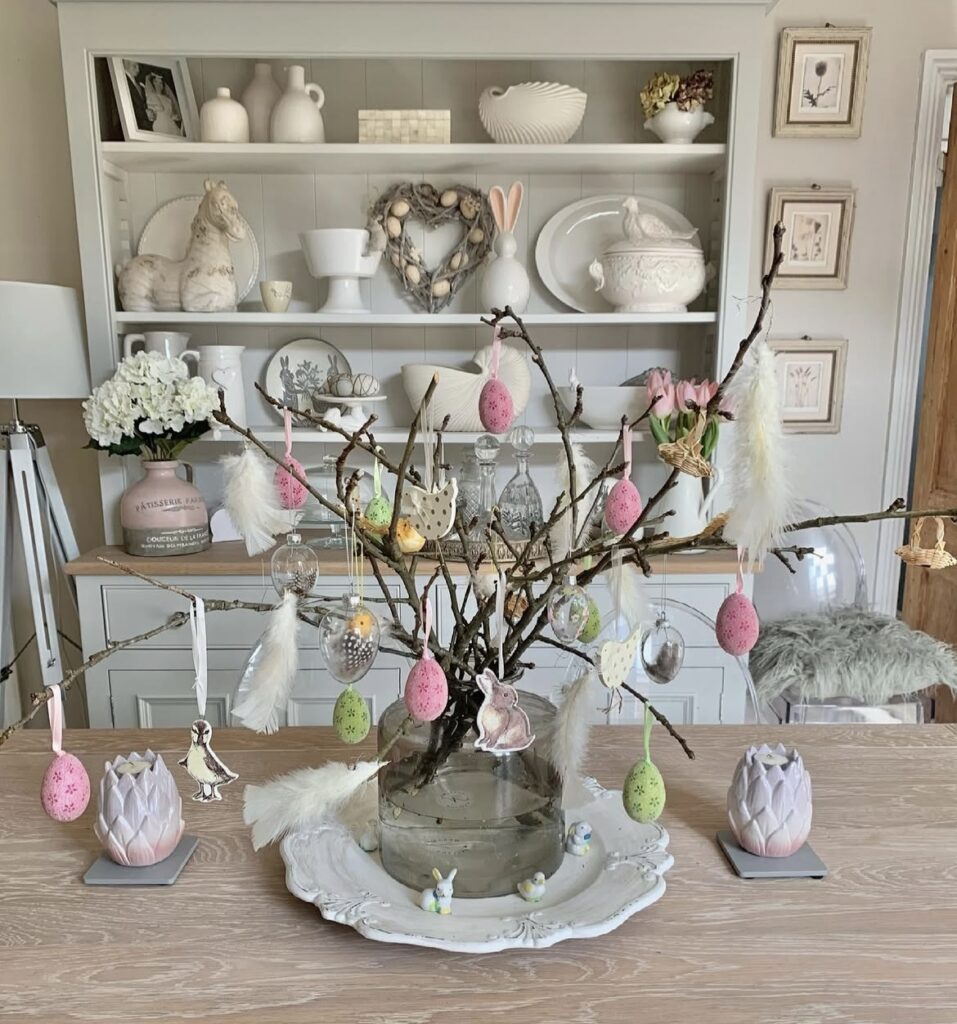 Branches filled with Easter eggs, rabbit and bird cutouts, and feathers.