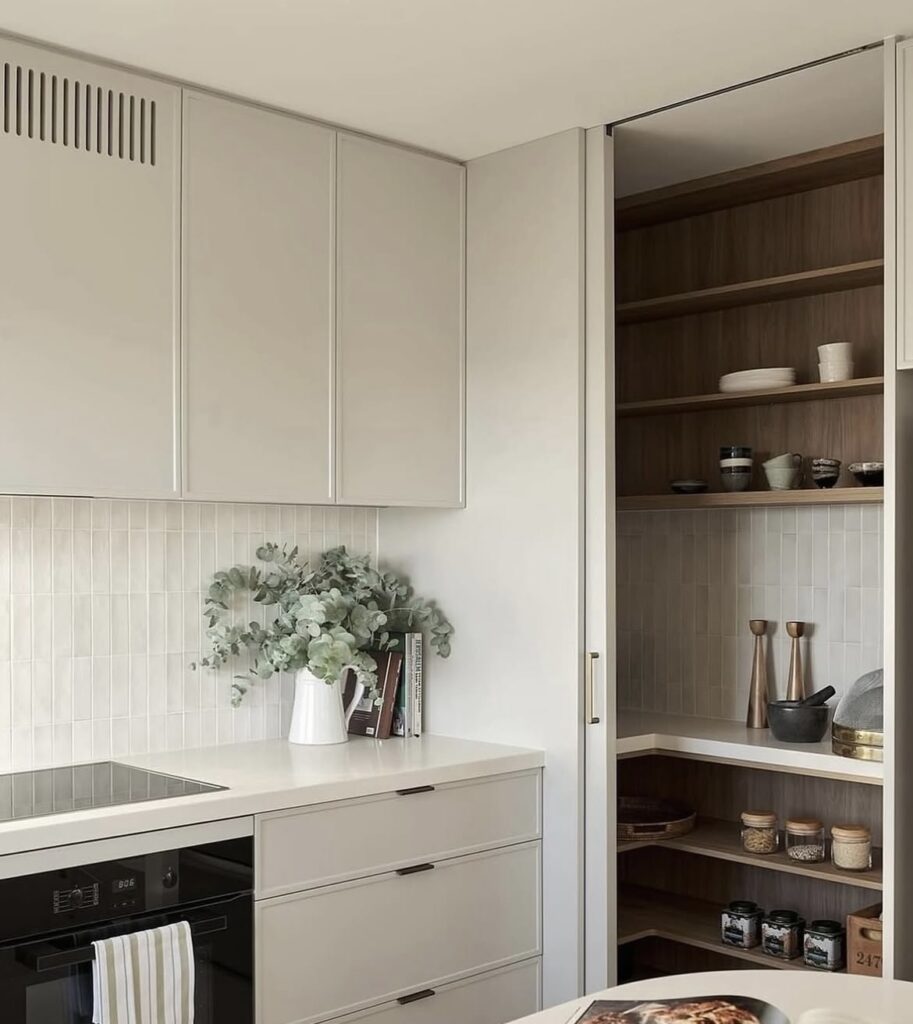 A modern kitchen with subway backsplash tiles.