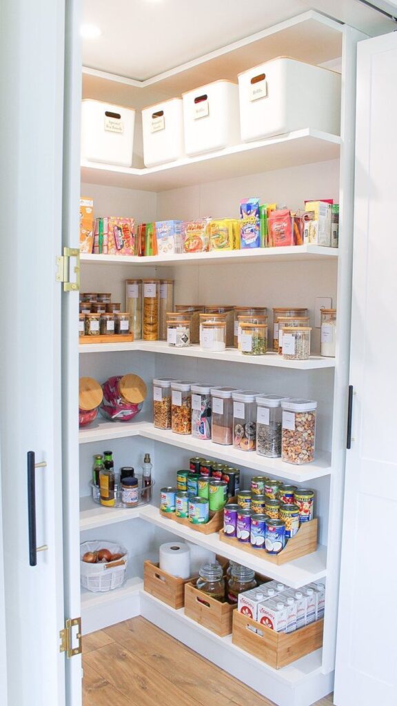 A small pantry with labels, glass jars and containers.