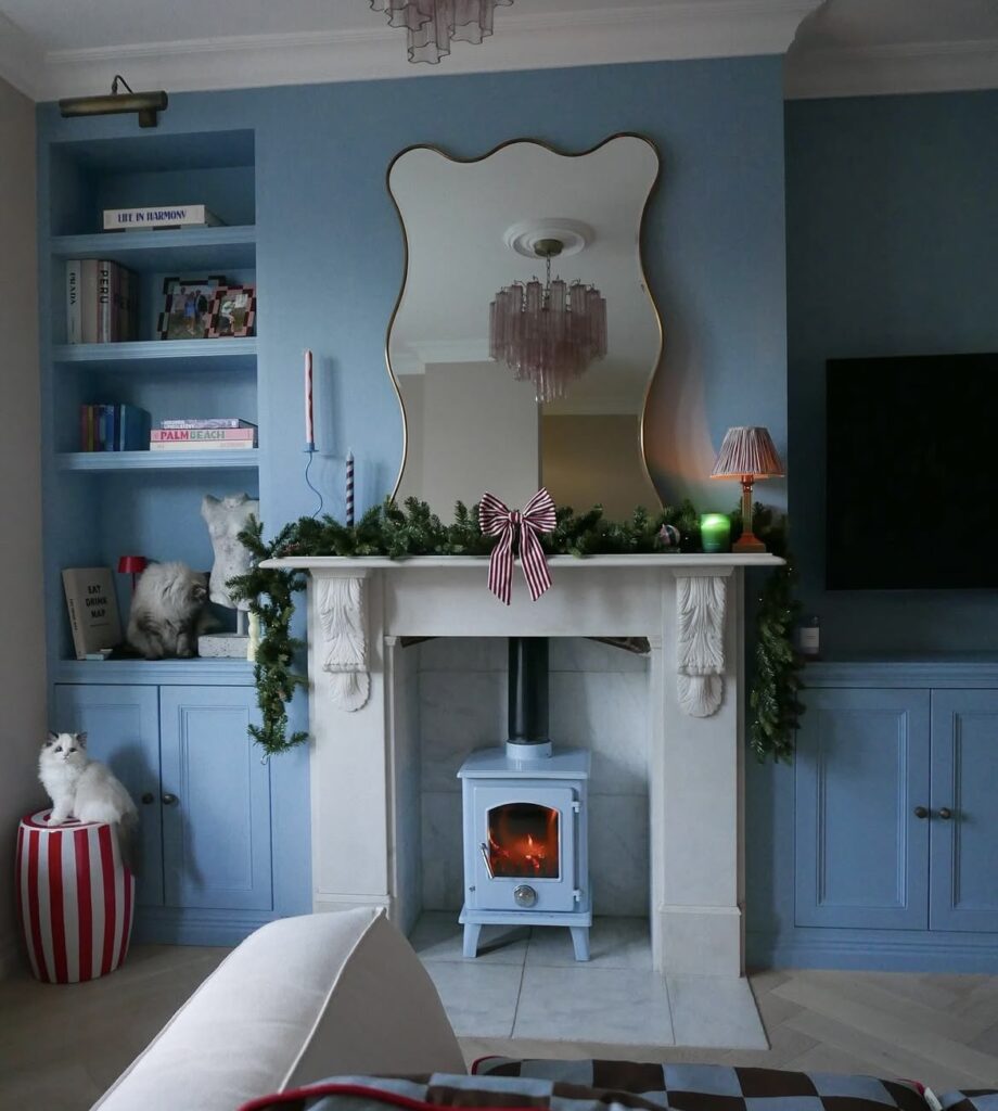 A traditional living room with a blue wall.