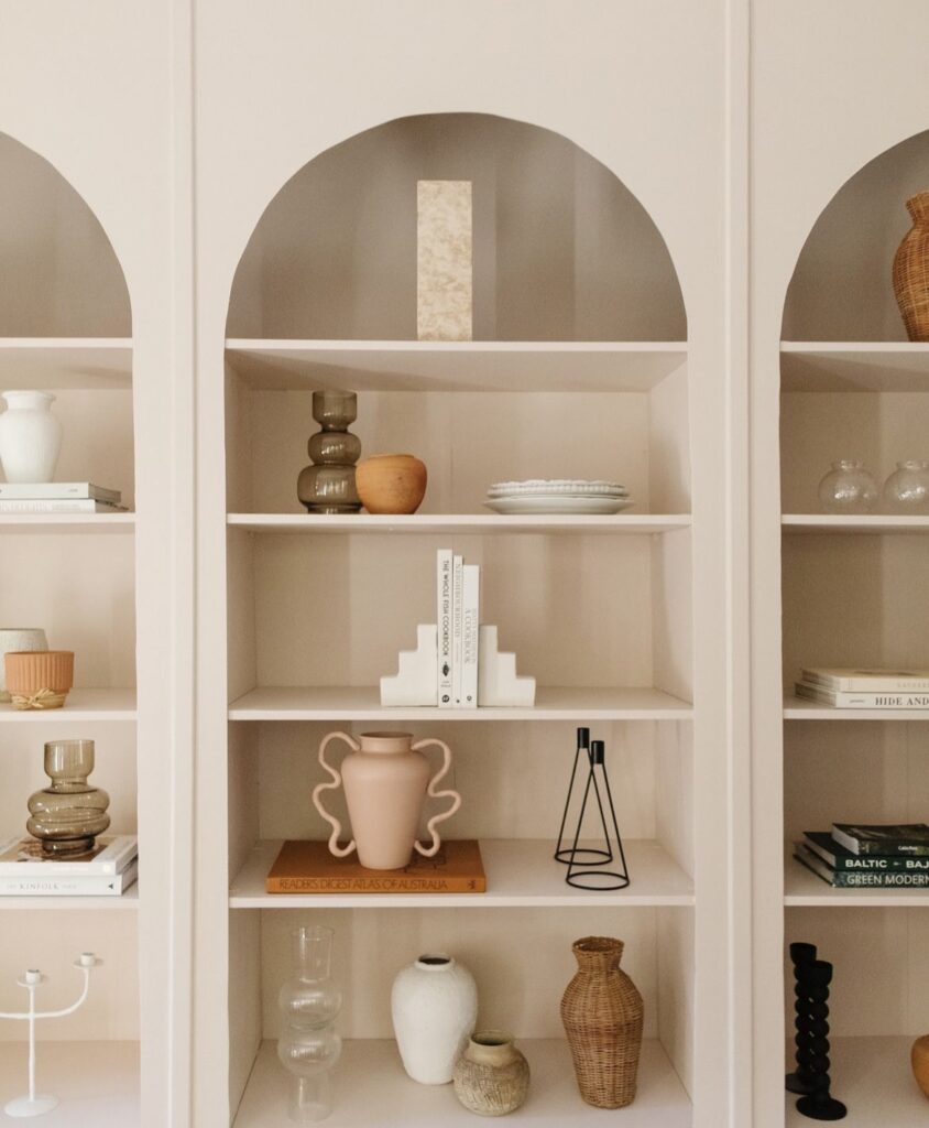 Arched bookshelves.