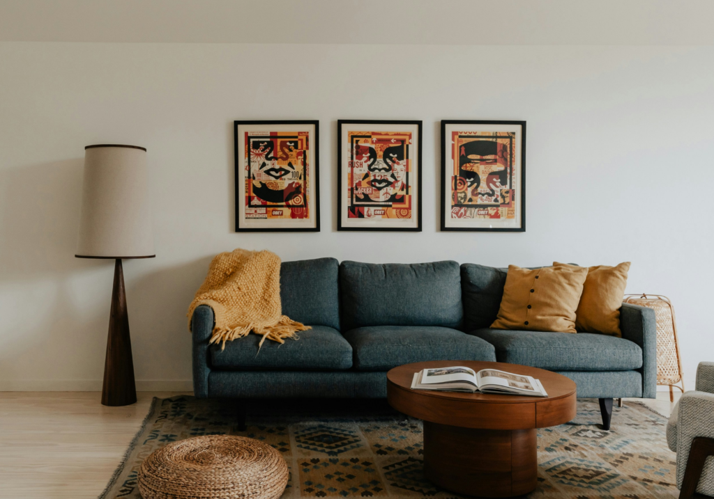 A traditional living room with wooden furniture and artworks.