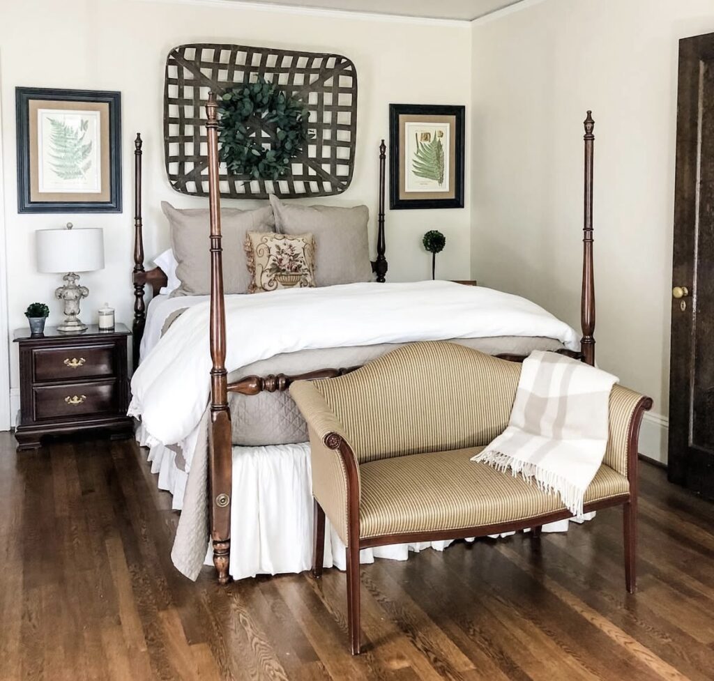 A bedroom with vintage furniture and hardwood floor.