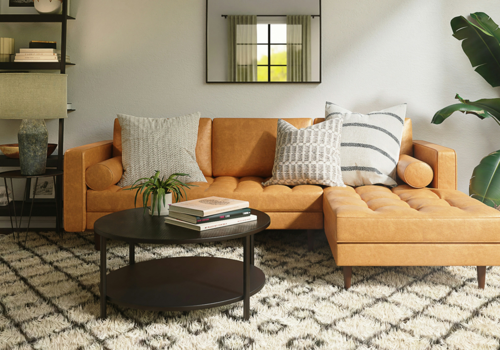 A living room with an orange sofa.