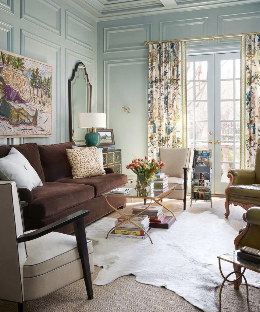 A traditional living room with velvet furniture.