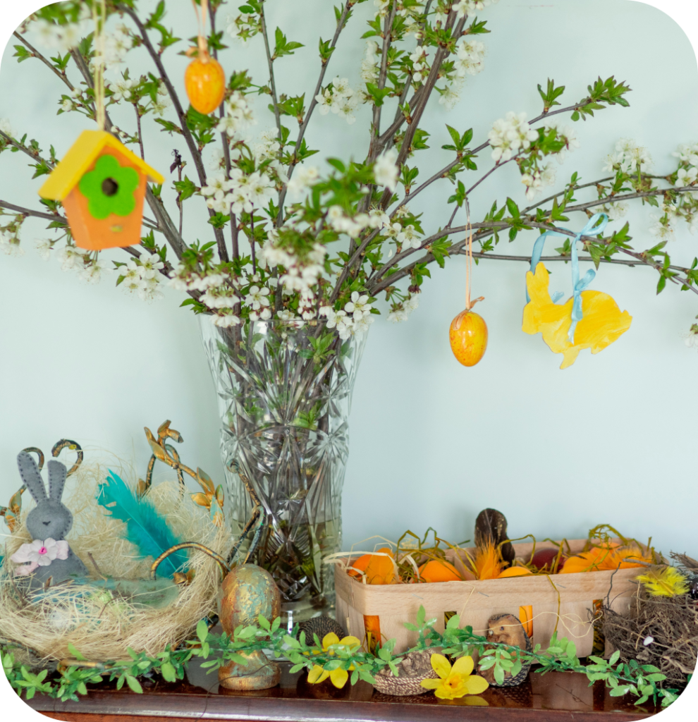 Cherry blossom branches with bird figurines.