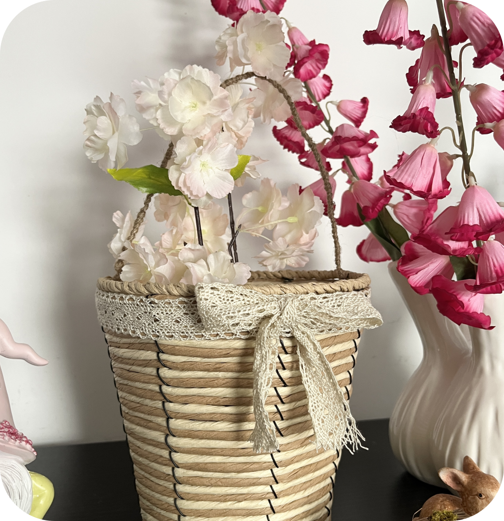 Woven Easter basket filled with Easter eggs and fake flowers. ©ASTRAPEARL - DO NOT USE