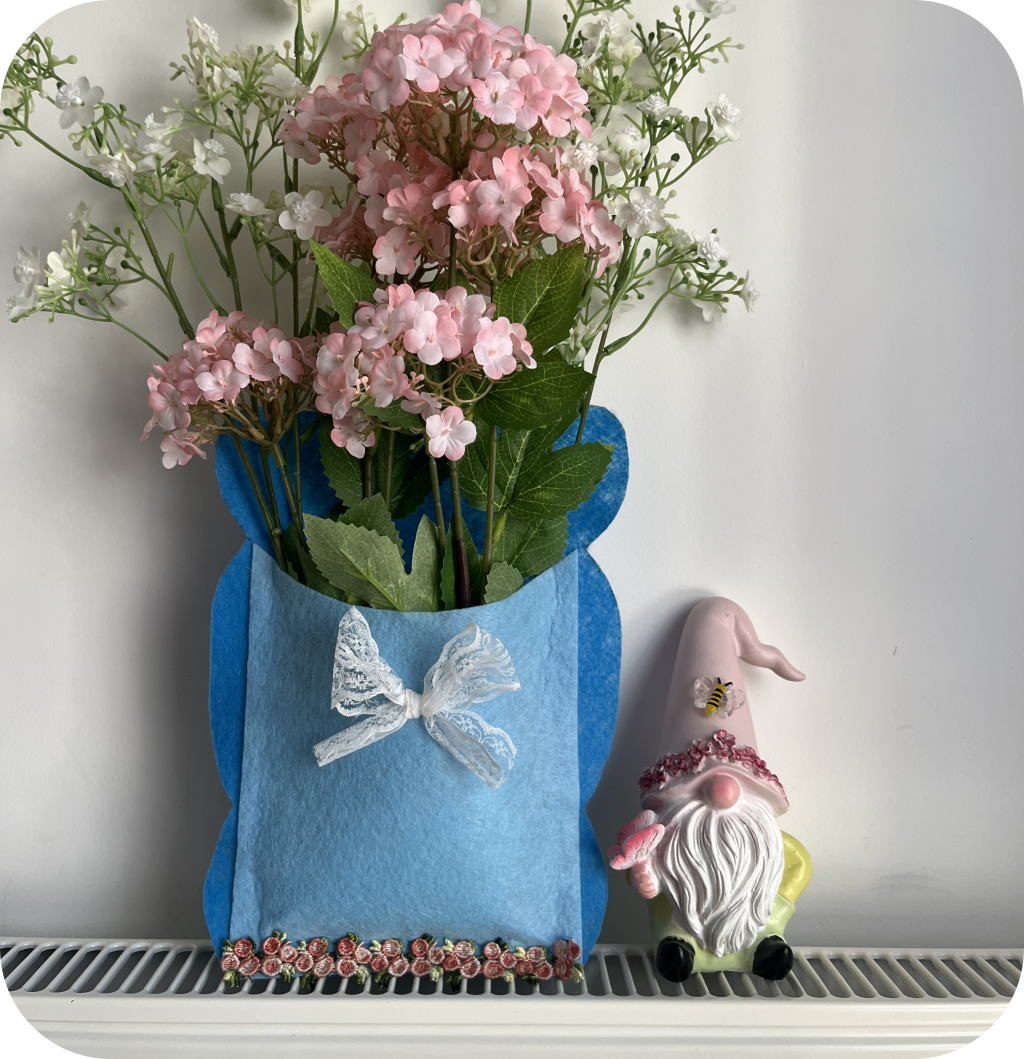 Blue felt mailbox filled with fake flowers and customized with lace. ©ASTRAPEARL - DO NOT USE