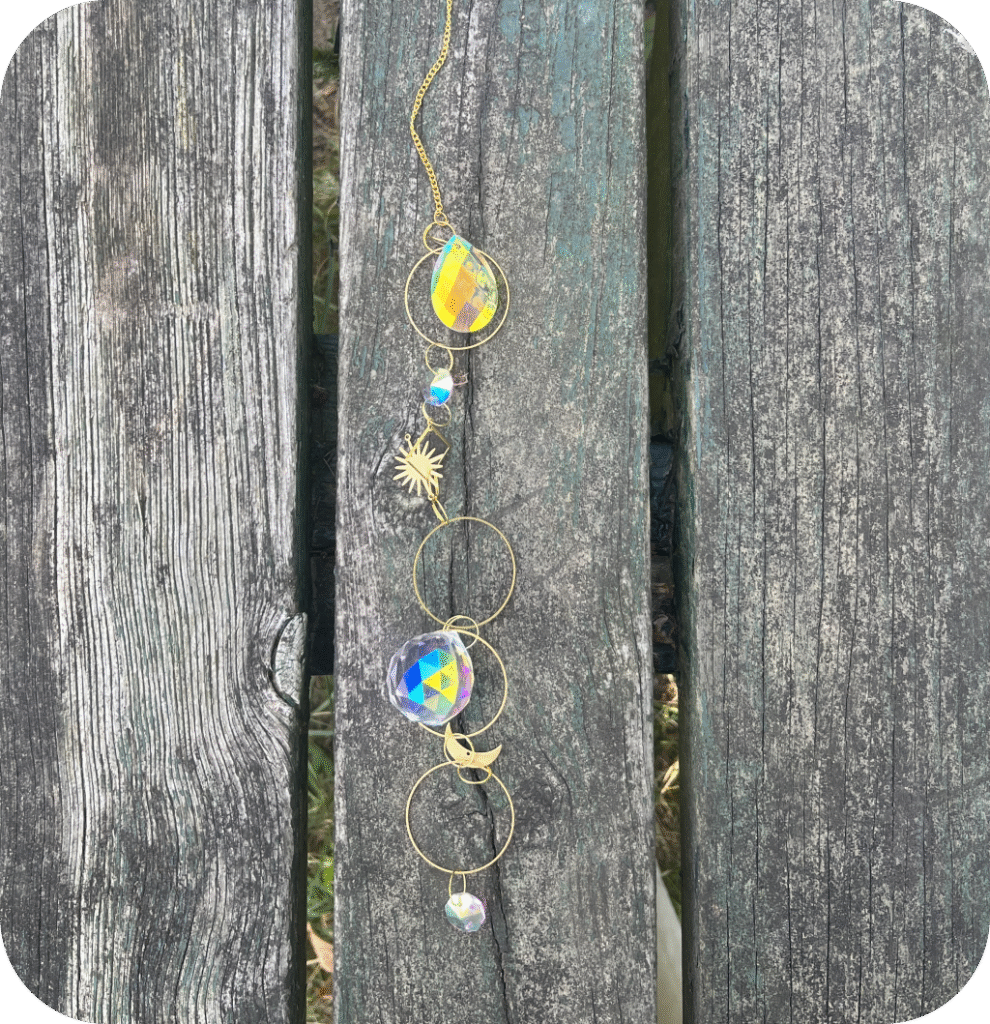 A suncatcher on a wooden table.